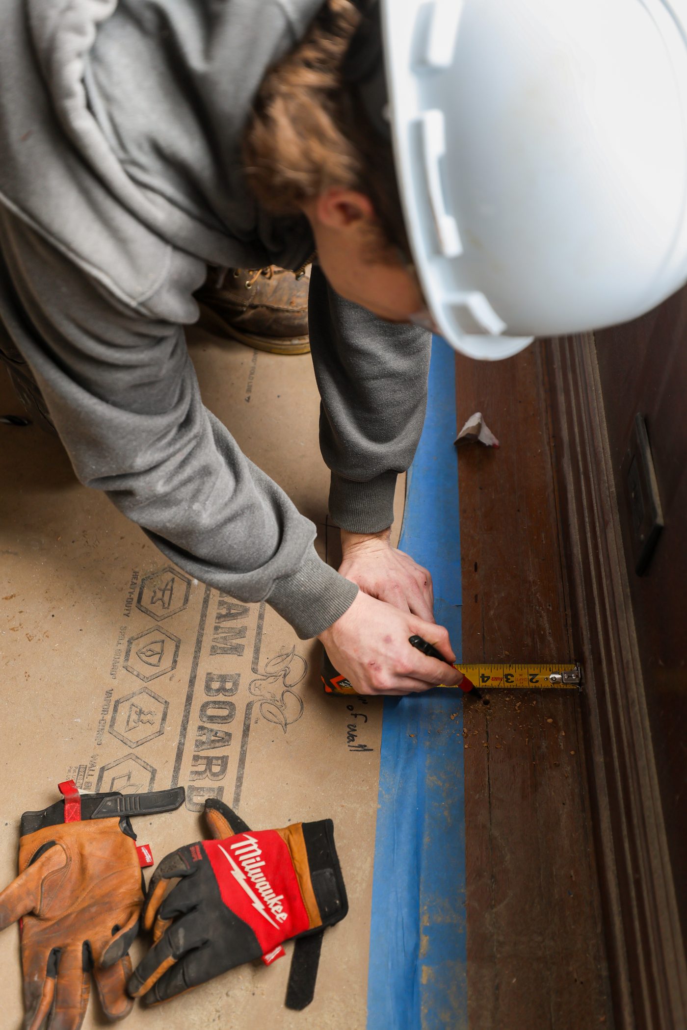 A Hertel technician measuring for a heating installation